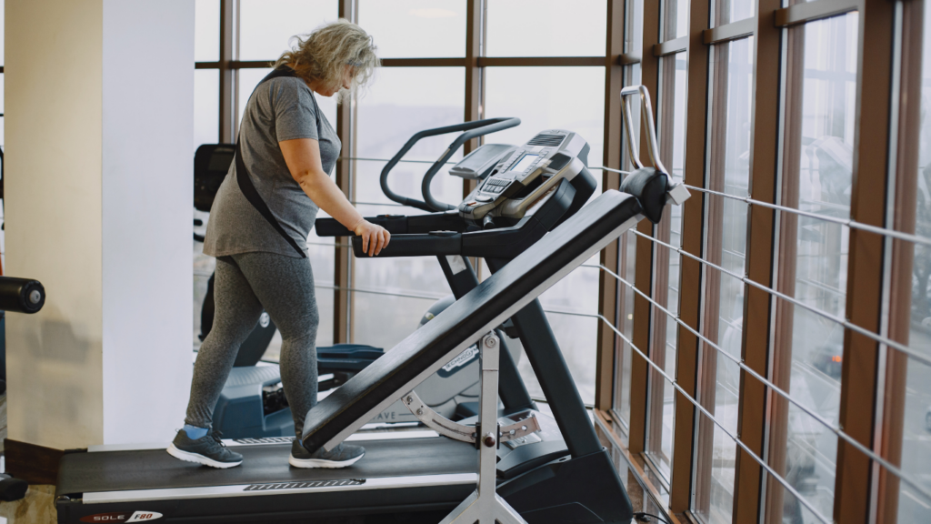 a person is on a treadmill in a gym