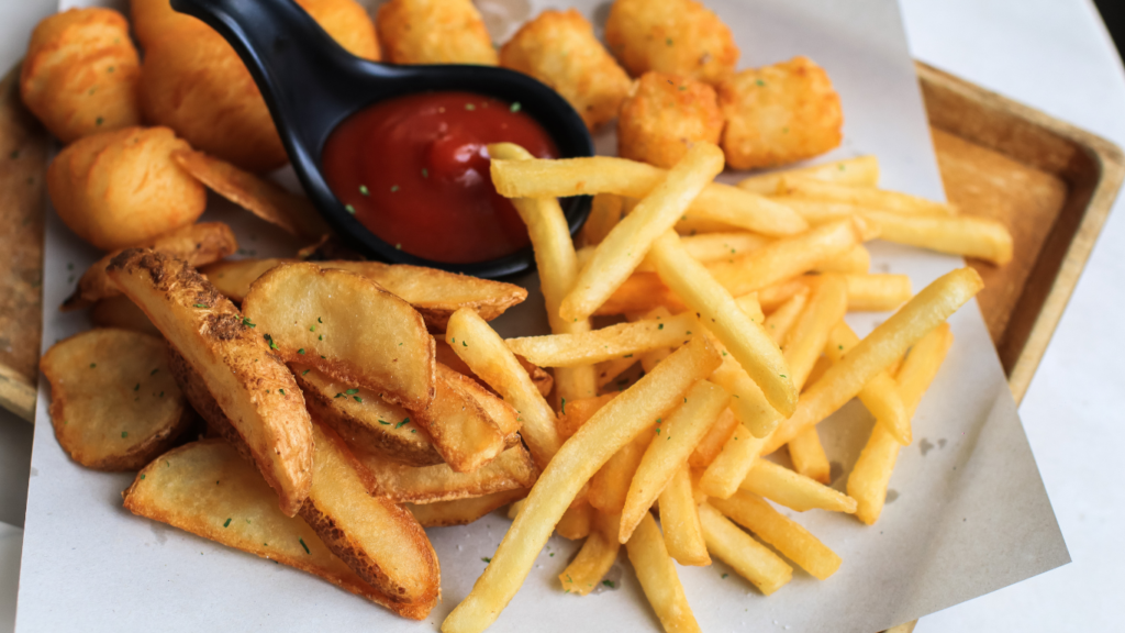 a tray with fries and ketchup on it