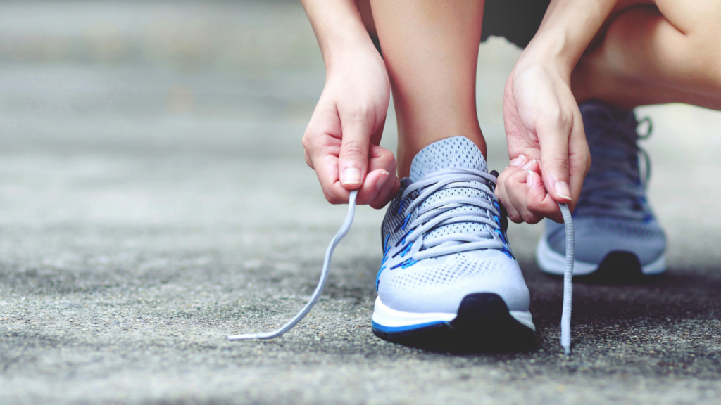 a close up of a person tying their shoes