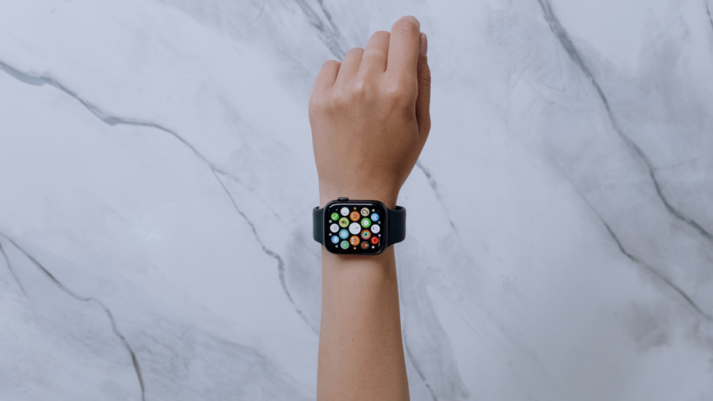 a person wearing an apple watch on their wrist