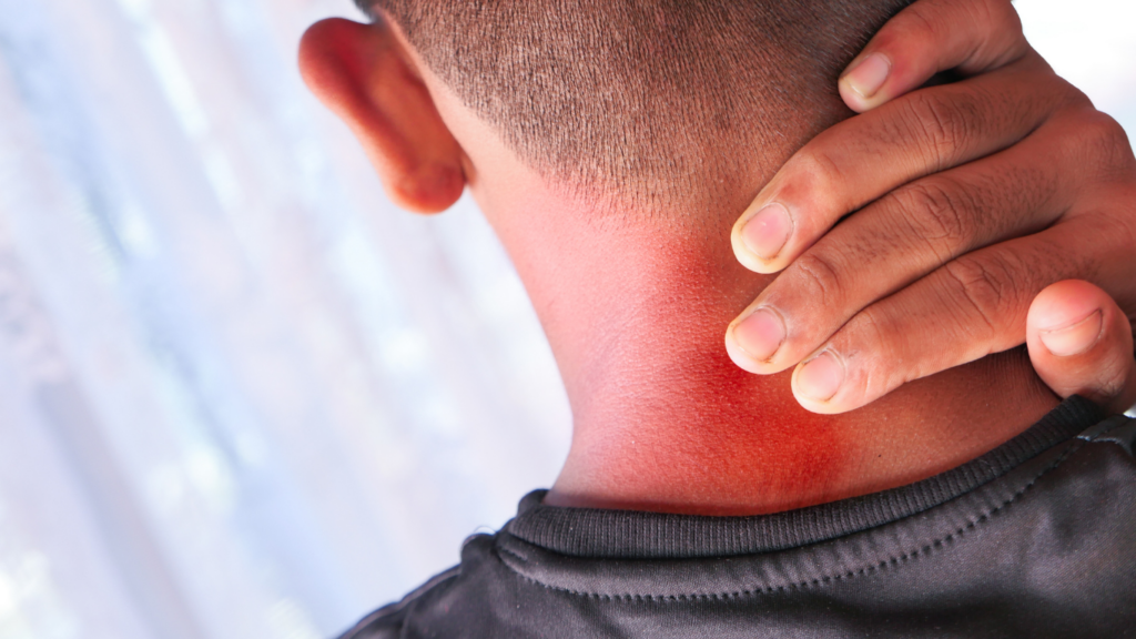 a person with a red spot on their neck