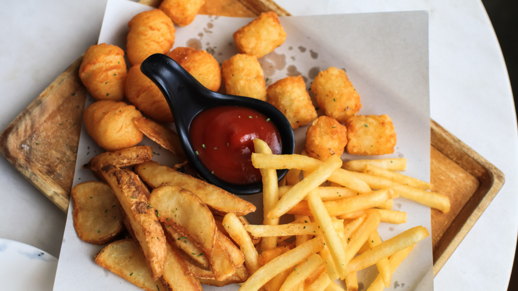 a tray with fries and ketchup on it