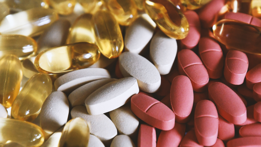 an assortment of vitamins and supplements on a table