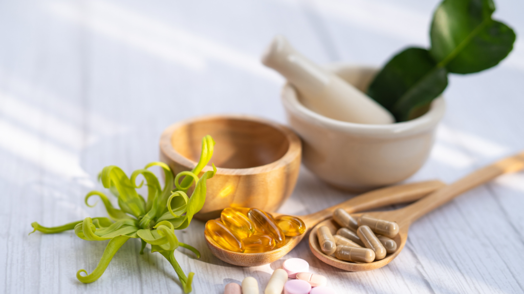 vitamins and supplements on a wooden table